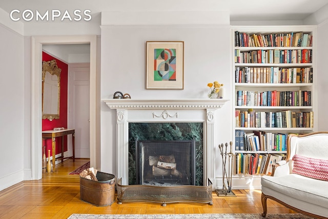 37-28 80th St Unit 32, New York City, NY 11372 - living area featuring a high end fireplace and built in shelves