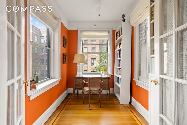 37-28 80th St Unit 32, New York City, NY 11372 - office area featuring light wood-type flooring and baseboards