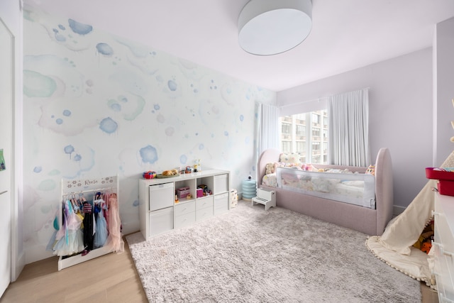 1355 1st Ave Unit 11Fl, New York City, NY 10021 - bedroom featuring light wood-type flooring