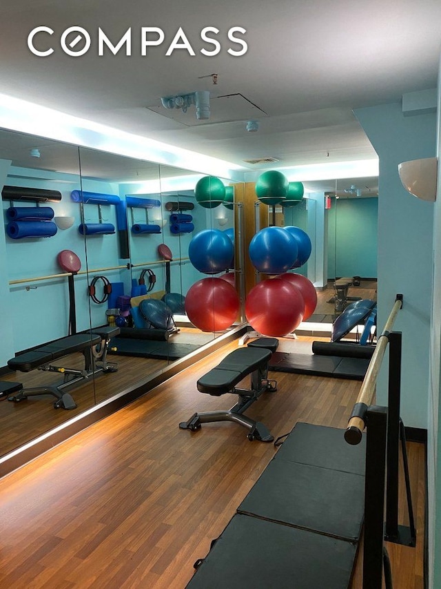 201 W 70th St Unit 8L, New York City, NY 10023 - exercise room featuring wood finished floors