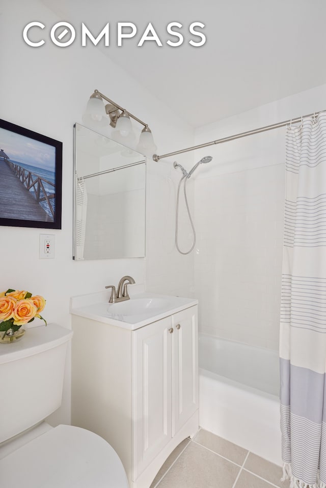 201 W 70th St Unit 8L, New York City, NY 10023 - bathroom featuring shower / bathtub combination with curtain, tile patterned flooring, and vanity