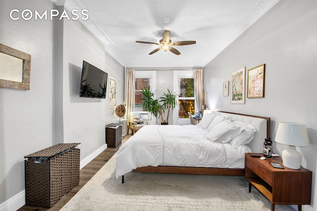 545 10th St, New York City, NY 11215 - bedroom featuring wood finished floors, baseboards, crown molding, and ceiling fan