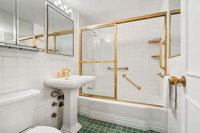 25 Sutton Pl S Unit 16L, New York City, NY 10022 - full bath featuring toilet, enclosed tub / shower combo, tile patterned floors, and tile walls