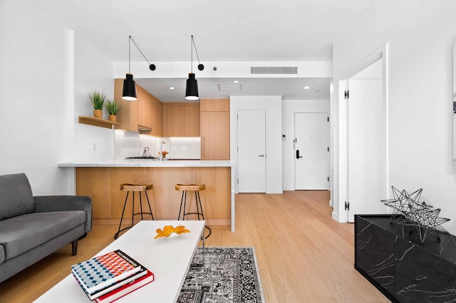 30-05 Vernon Blvd Unit 5-D, New York City, NY 11102 - living area with light wood-style flooring and recessed lighting