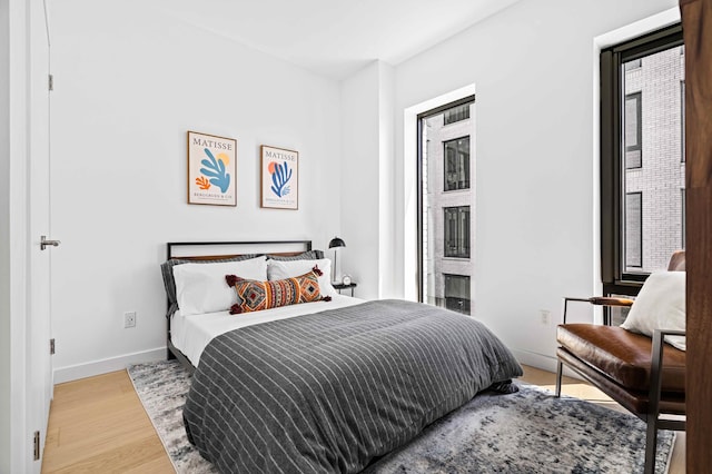 30-05 Vernon Blvd Unit 5-D, New York City, NY 11102 - bedroom with baseboards and wood finished floors