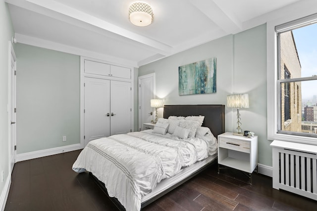 10 W 86th St Unit 15A, New York City, NY 10024 - bedroom with radiator, beam ceiling, baseboards, dark wood-style floors, and a closet