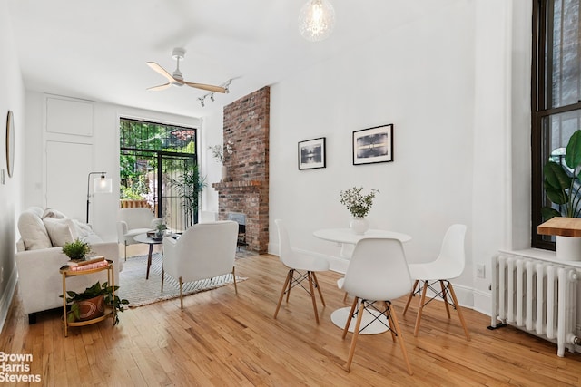 354 Baltic St Unit 2, New York City, NY 11201 - dining area with radiator, light wood-style flooring, a ceiling fan, and baseboards