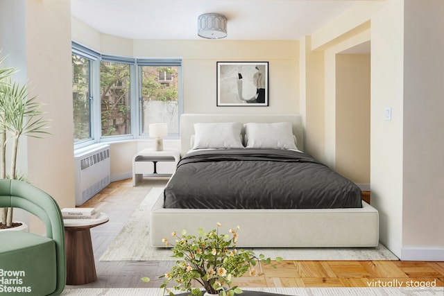 249 E 48th St Unit 3A, New York City, NY 10017 - bedroom with radiator and baseboards