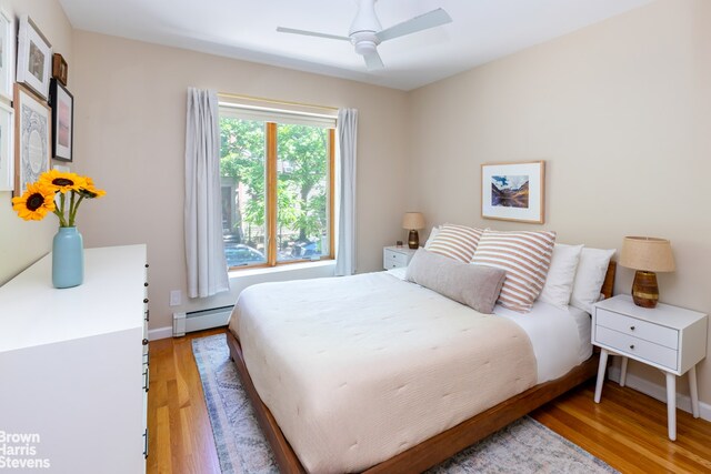 20 Jackson Pl Unit 3, New York City, NY 11215 - bedroom with a baseboard radiator, light wood-style flooring, a ceiling fan, and baseboards