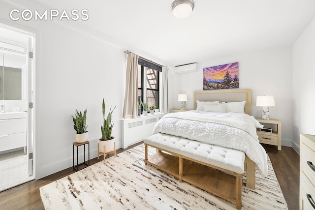 9511 Shore Rd Unit 505, New York City, NY 11209 - bedroom with a wall mounted air conditioner, radiator heating unit, dark wood finished floors, and baseboards