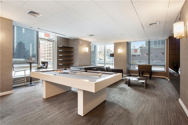 247 W 46th St Unit 3505, New York City, NY 10036 - game room featuring a wall of windows and wood finished floors