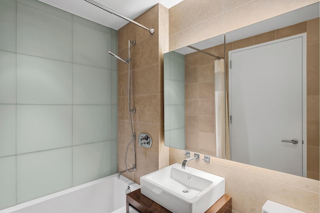 247 W 46th St Unit 3505, New York City, NY 10036 - full bath featuring tile walls, shower / bath combo, and vanity