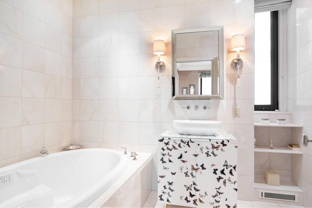 480 Park Ave Unit 15E, New York City, NY 10022 - full bath featuring a bath, tile walls, vanity, and plenty of natural light