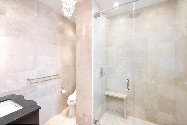 480 Park Ave Unit 15E, New York City, NY 10022 - bathroom featuring tile walls, vanity, a shower stall, toilet, and tile patterned floors