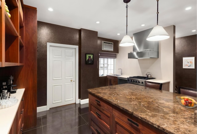480 Park Ave Unit 15E, New York City, NY 10022 - kitchen featuring appliances with stainless steel finishes, wall chimney range hood, a sink, recessed lighting, and baseboards