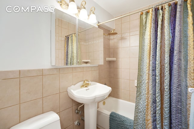 5700 Arlington Ave Unit 16T, New York City, NY 10471 - bathroom with tile walls, shower / tub combo, and toilet