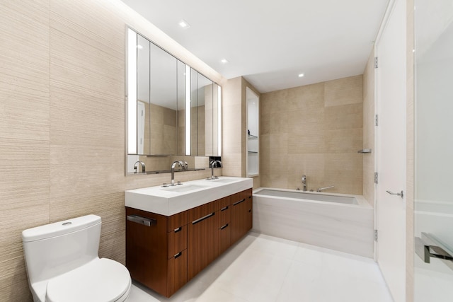 1 W End Ave Unit 14E, New York City, NY 10023 - full bathroom featuring double vanity, a bath, toilet, tile walls, and tile patterned floors