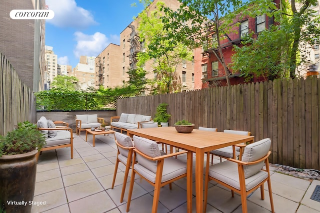 345 E 69th St Unit 2B, New York City, NY 10021 - fenced backyard featuring an outdoor hangout area, a patio area, and outdoor dining space