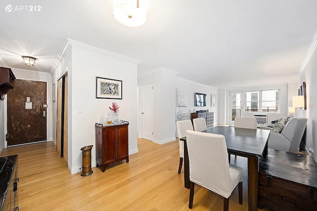 340 E 80th St Unit 20-J, New York City, NY 10075 - dining area with crown molding, light wood-style floors, and baseboards