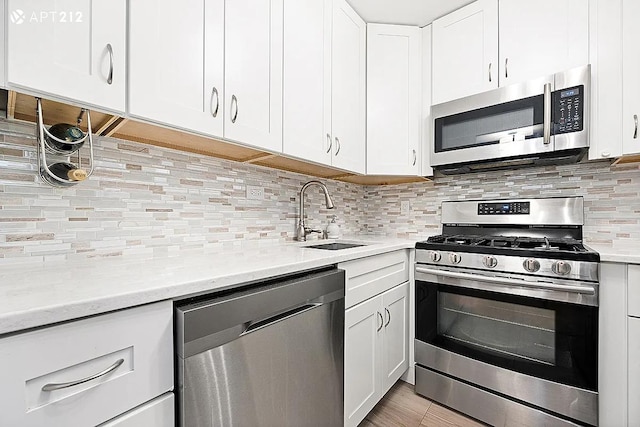 340 E 80th St Unit 20-J, New York City, NY 10075 - kitchen with appliances with stainless steel finishes, a sink, and light countertops