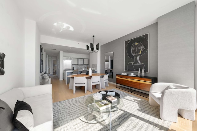 210 Lafayette St Unit 5A, New York City, NY 10012 - living room with light wood-type flooring and arched walkways