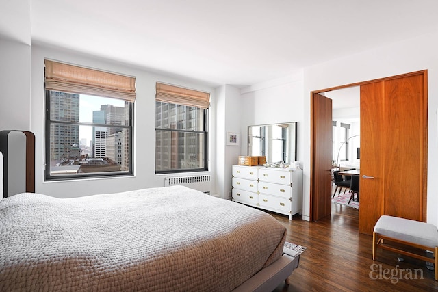 55 Liberty St Unit 24Bc, New York City, NY 10005 - bedroom featuring radiator heating unit and dark wood-style flooring