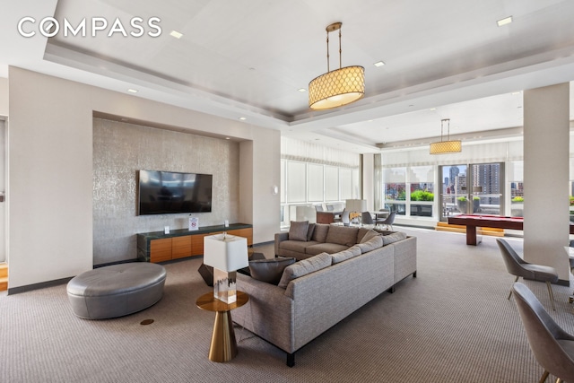 415 Main St Unit 4G, New York City, NY 10044 - living room with a raised ceiling, carpet, and baseboards