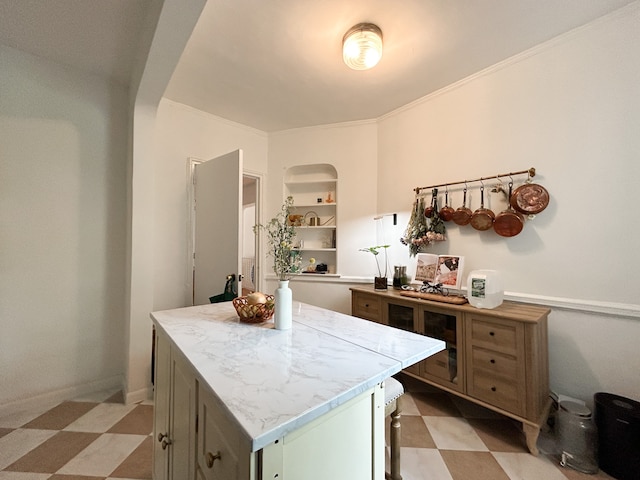 100 Bennett Ave Unit 4B, New York City, NY 10033 - kitchen featuring light flooring, a center island, and arched walkways