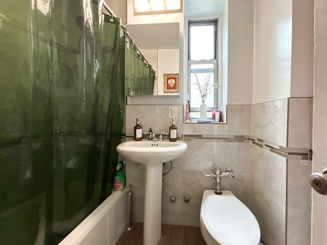 100 Bennett Ave Unit 4B, New York City, NY 10033 - full bathroom with tile walls, shower / bath combination with curtain, a sink, and toilet