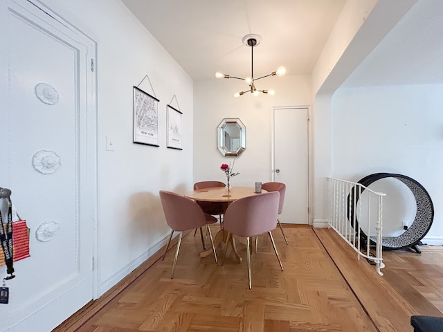 100 Bennett Ave Unit 4B, New York City, NY 10033 - dining area with a chandelier and baseboards