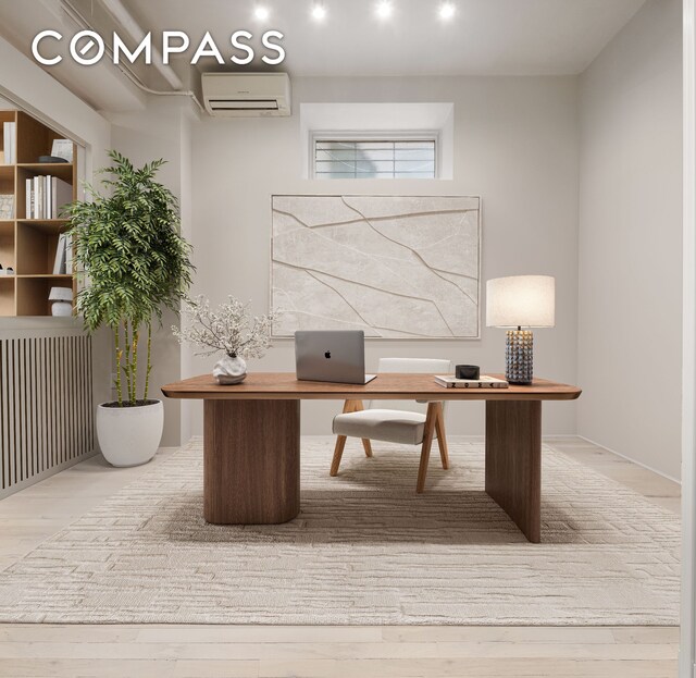 28 W 38th St Unit 6E, New York City, NY 10018 - home office featuring a wall unit AC and wood finished floors