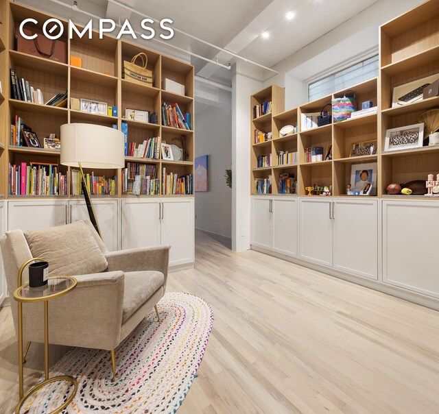 28 W 38th St Unit 6E, New York City, NY 10018 - living area with light wood-style floors and baseboards