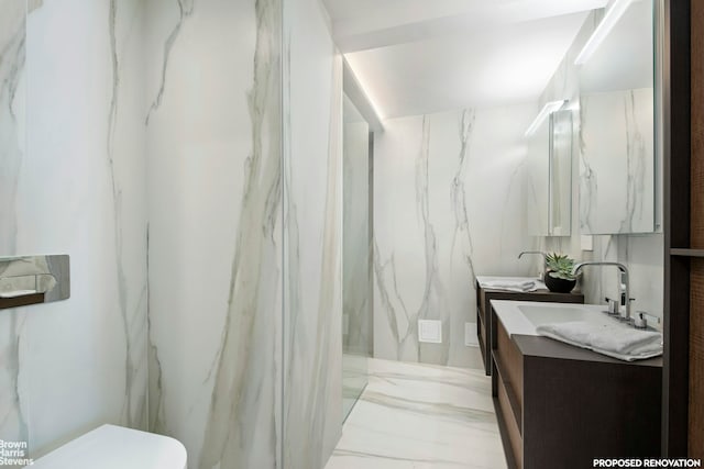230 E 73rd St Unit 8Def, New York City, NY 10021 - bathroom featuring double vanity, marble tiled flooring, toilet, and a marble finish shower