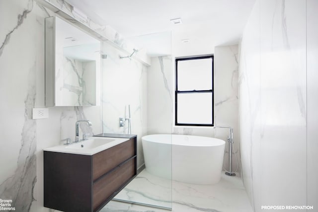 230 E 73rd St Unit 8Def, New York City, NY 10021 - bathroom featuring marble tiled floors, vanity, and a freestanding tub