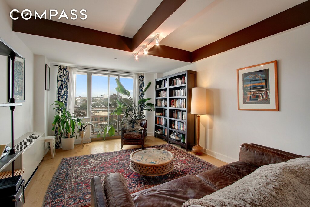 343 4th Ave Unit 9F, New York City, NY 11215 - sitting room featuring rail lighting, wood finished floors, and baseboards