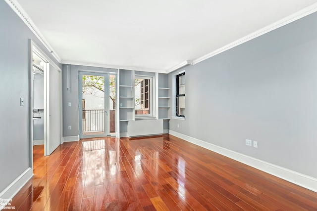 18 Morningside Ave Unit 3, New York City, NY 10026 - empty room with ornamental molding, wood finished floors, baseboards, and built in shelves