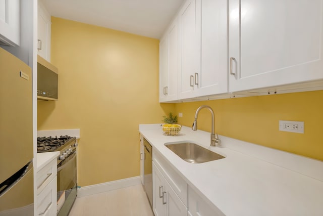 233 E 86th St Unit 4A, New York City, NY 10028 - kitchen with stainless steel appliances, white cabinets, and light countertops