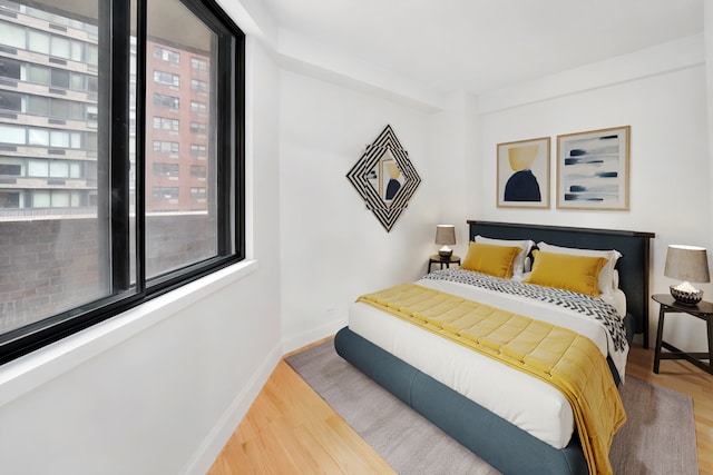 233 E 86th St Unit 4A, New York City, NY 10028 - bedroom with wood finished floors