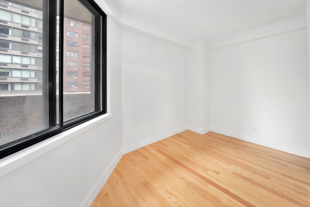 233 E 86th St Unit 4A, New York City, NY 10028 - unfurnished room with wood finished floors and baseboards