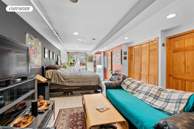 238 26th St, New York City, NY 11232 - bedroom featuring recessed lighting, tile patterned floors, and a closet