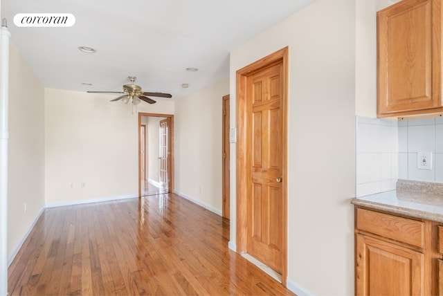 238 26th St, New York City, NY 11232 - hallway with light wood-style floors and baseboards