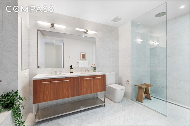 90 Furman St Unit N107, New York City, NY 11201 - full bath featuring tile walls, double vanity, toilet, and a walk in shower