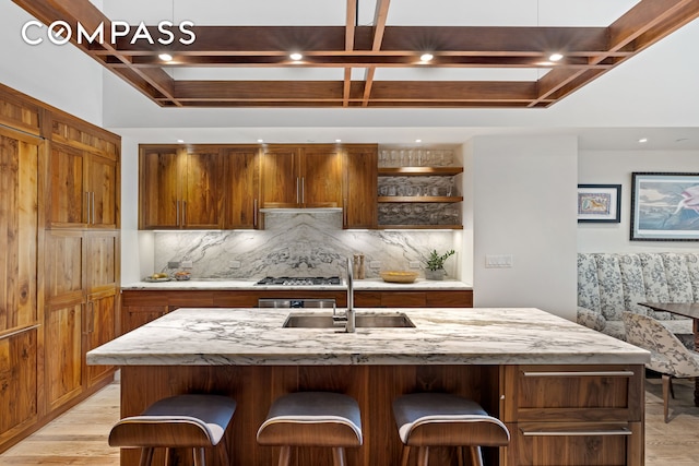 90 Furman St Unit N107, New York City, NY 11201 - kitchen featuring coffered ceiling, light wood-style flooring, backsplash, open shelves, and beamed ceiling