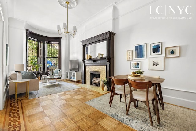 632 W End Ave Unit 2F, New York City, NY 10024 - sitting room with a chandelier, a fireplace, and baseboards