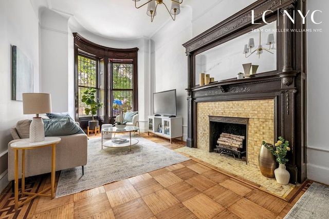 632 W End Ave Unit 2F, New York City, NY 10024 - living room with a chandelier, a tile fireplace, and crown molding
