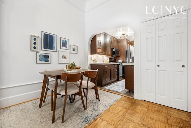 632 W End Ave Unit 2F, New York City, NY 10024 - dining area featuring arched walkways and baseboards