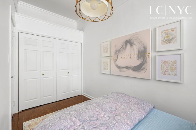 632 W End Ave Unit 2F, New York City, NY 10024 - bedroom with wood finished floors, a closet, and crown molding