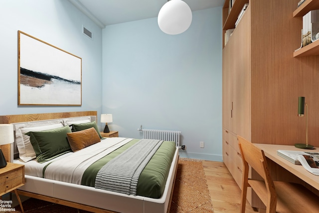 46 Great Jones St Unit 7, New York City, NY 10012 - bedroom with radiator and light wood-style floors