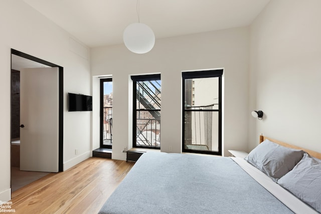 46 Great Jones St Unit 7, New York City, NY 10012 - bedroom featuring light wood-type flooring and baseboards