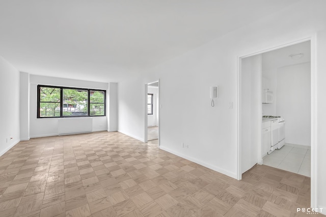 345 E 80th St Unit 5-L, New York City, NY 10075 - empty room featuring baseboards